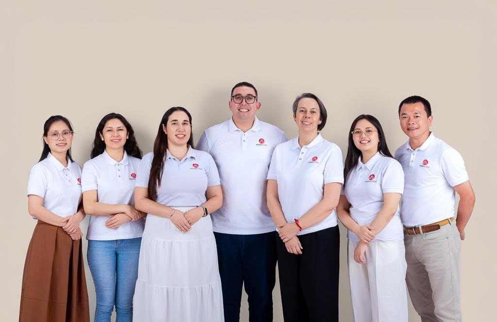 Members of the Mundo Asia Tours team in a studio portrait