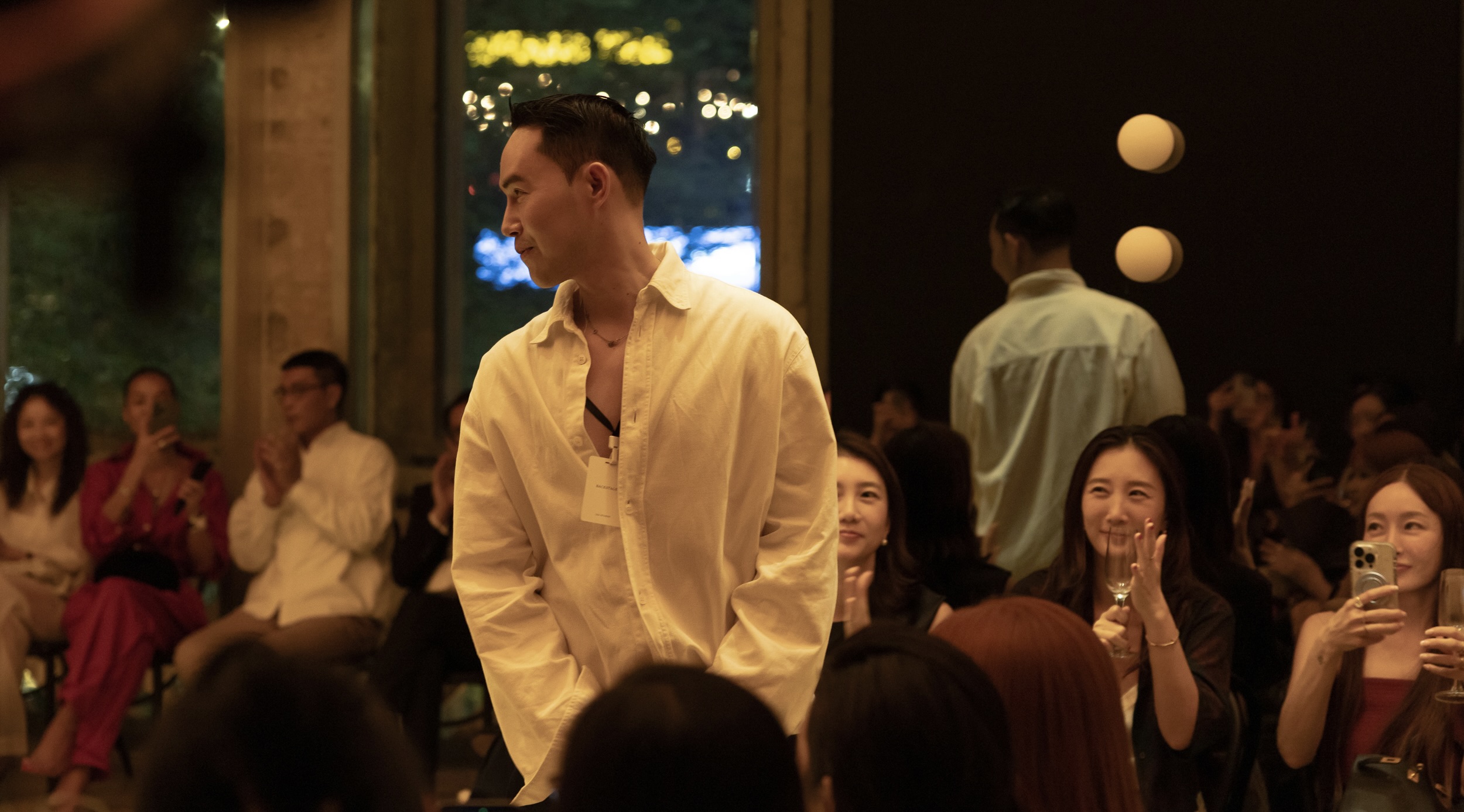 Lam Gia Khang stands among the audience at a Gia Studios show