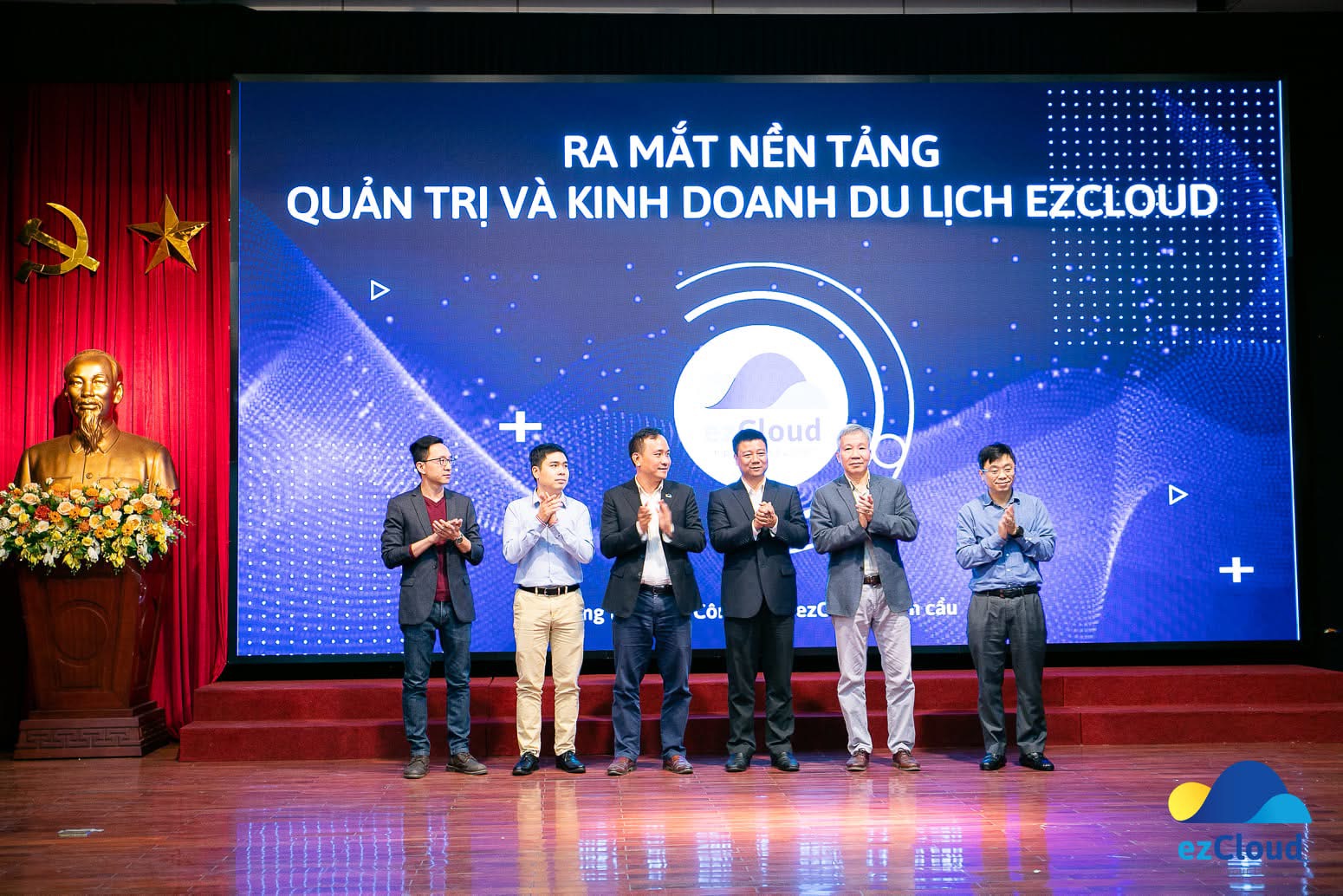 ezCloud executives on stage at the launch of its hotel and tourism management platform