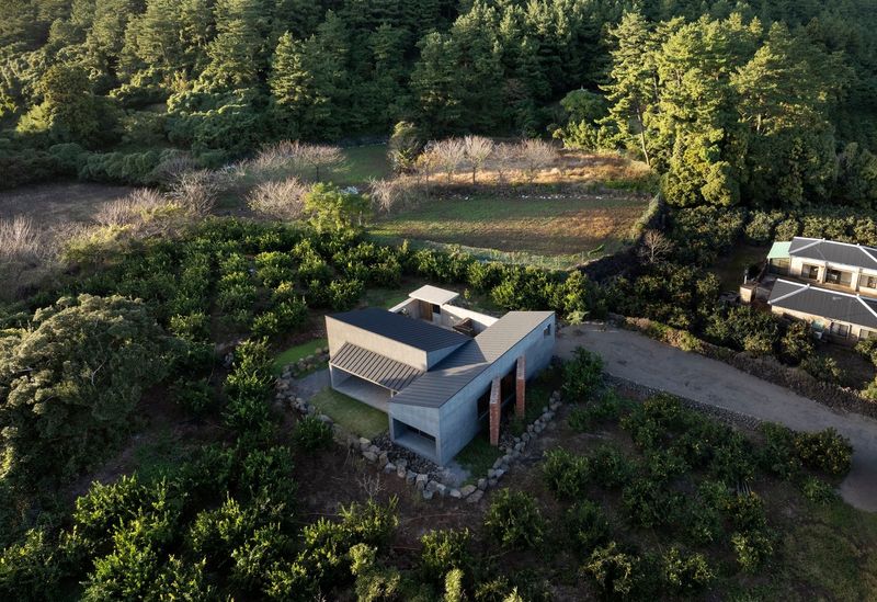 Building Time Into Place: A House Beneath Jeju's Volcanic Landscape