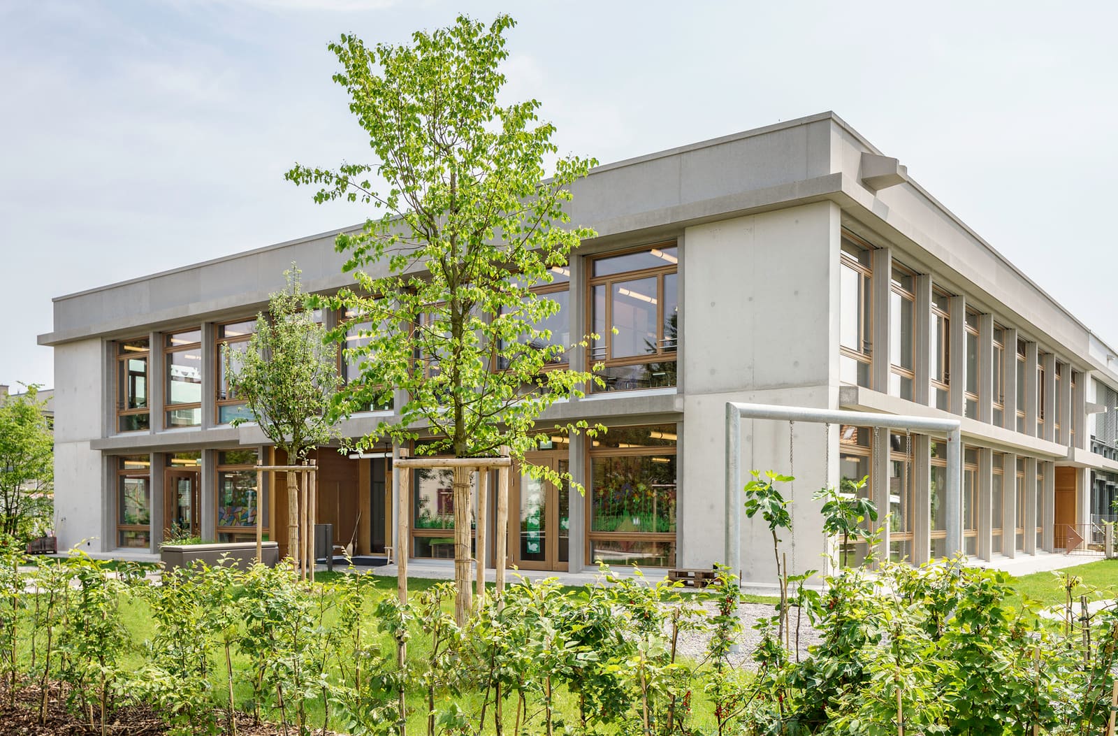 Four Pavilions and a Courtyard: A Swiss School Embraces Orthogonal Clarity