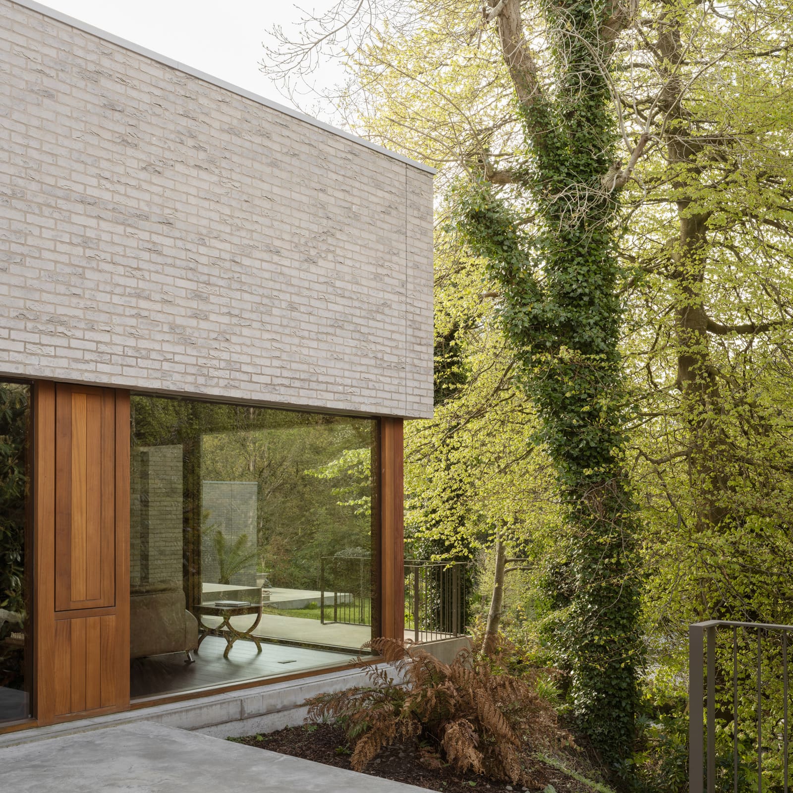 Six Brick Pavilions Cascade Down a Northern Ireland Riverbank