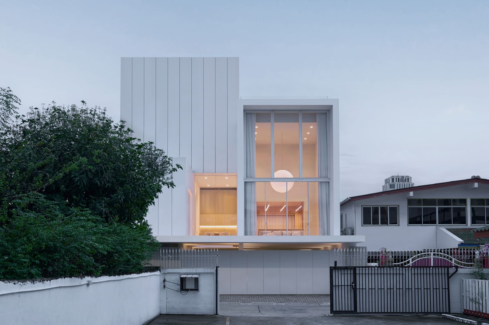 Three Stacked Volumes Float Above Bangkok's Traffic