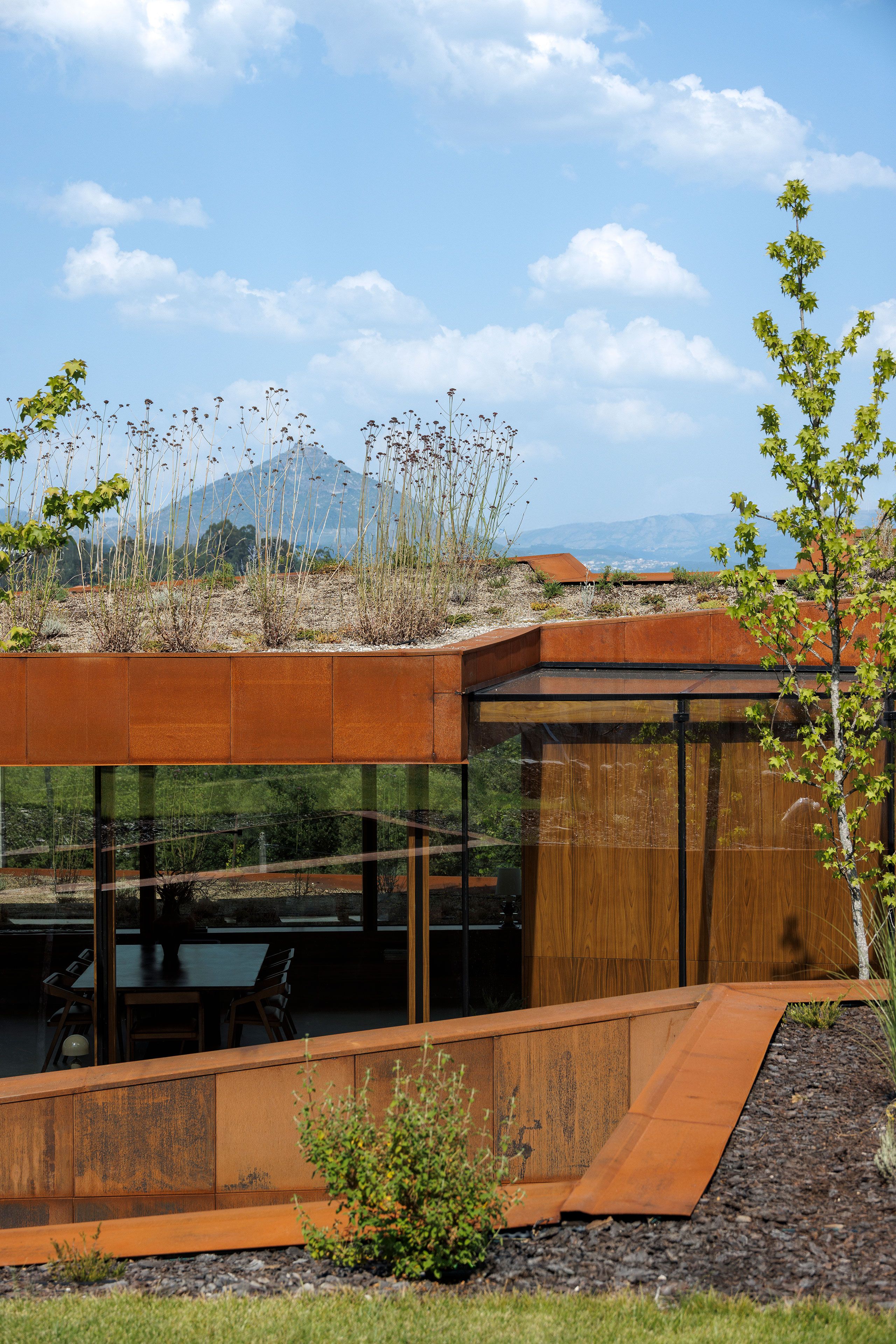 Casa Corten: A Weathered Steel Home That Grows From Portugal’s Hillside