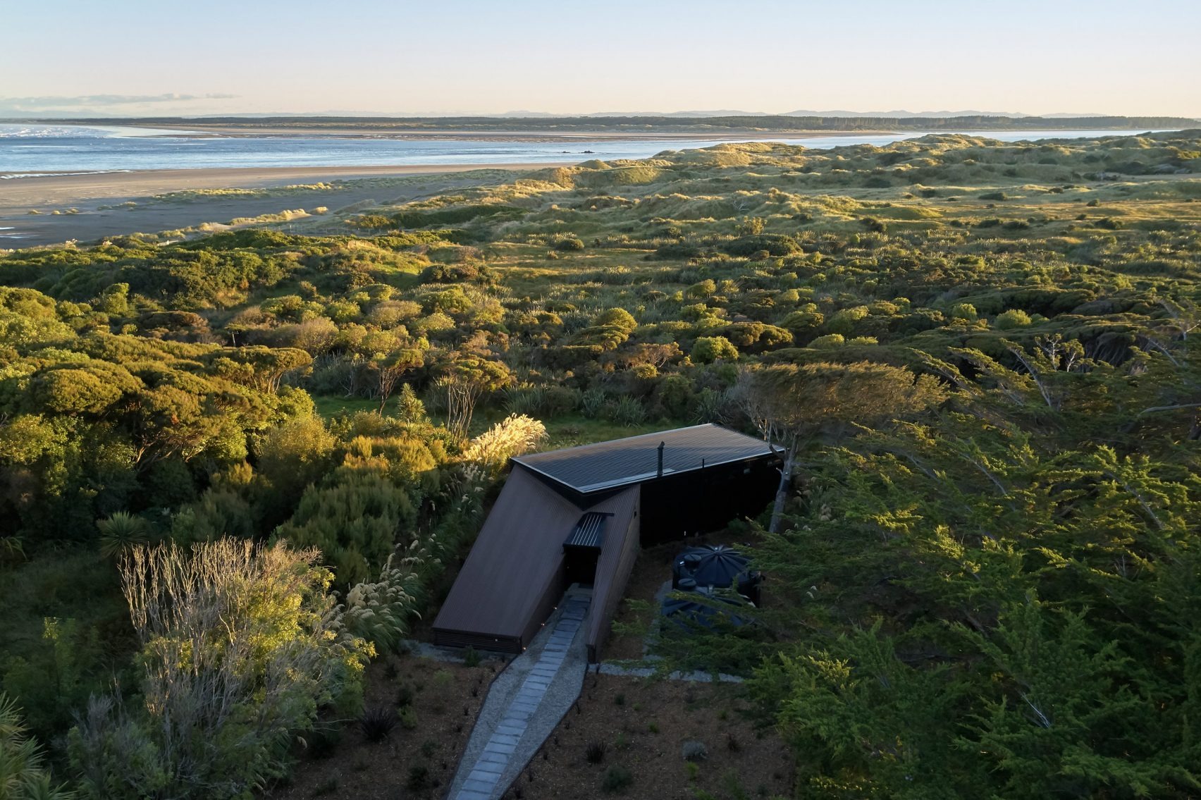 Coast House by Stacey Farrell: Weathered Volumes on New Zealand's Rugged Shoreline
