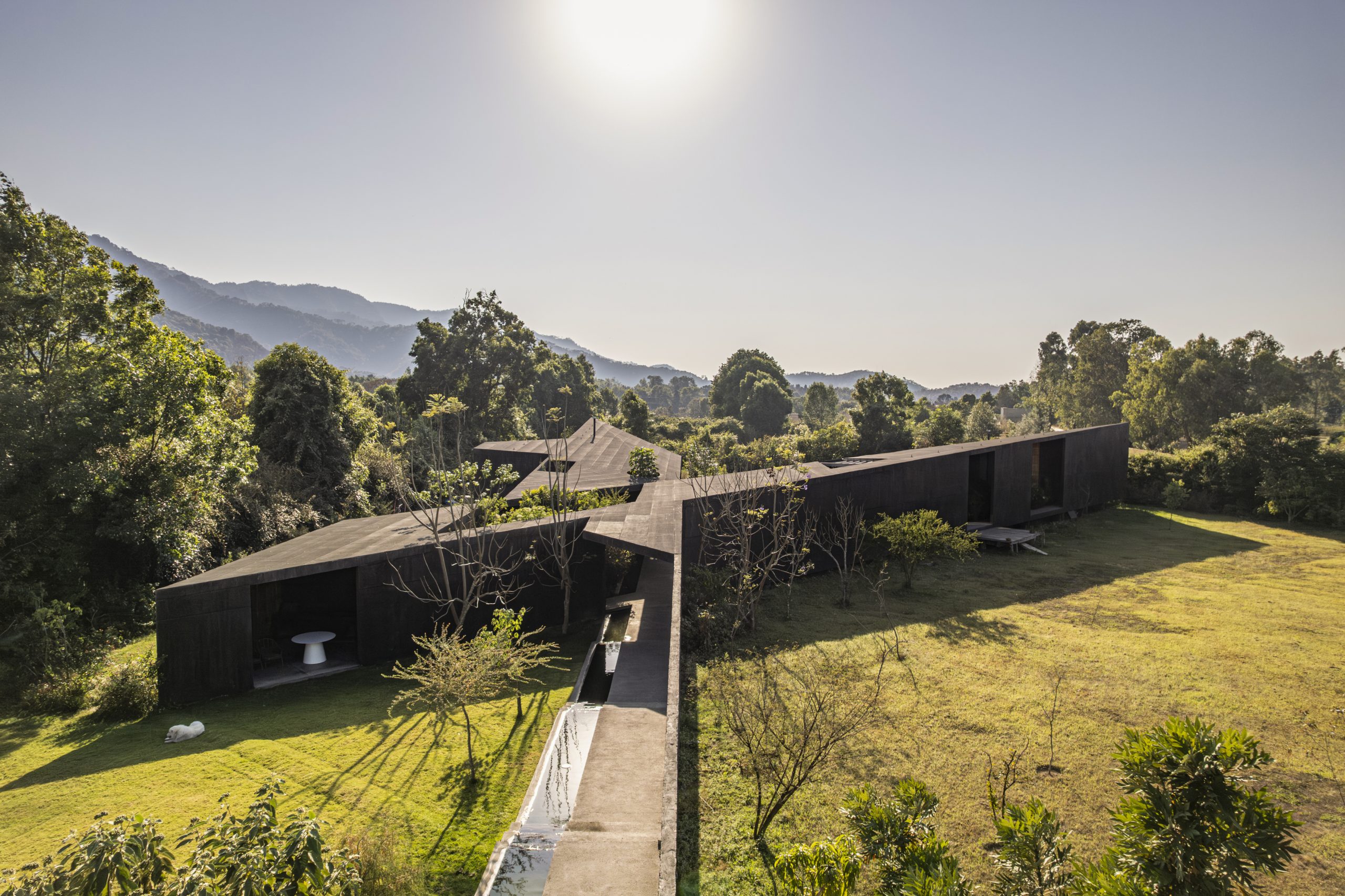 House Mavra: Where Black Concrete Frames The Landscape
