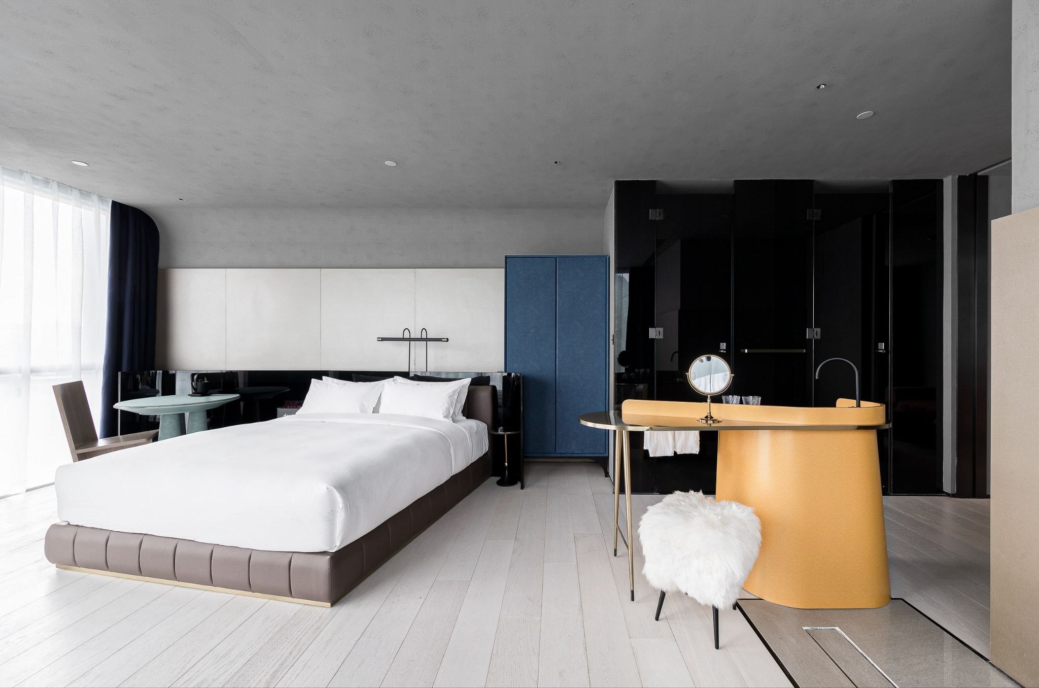 Sonmei Hotel: Where Minimalism Meets Fluid Geometry in Shenzhen's Urban Landscape