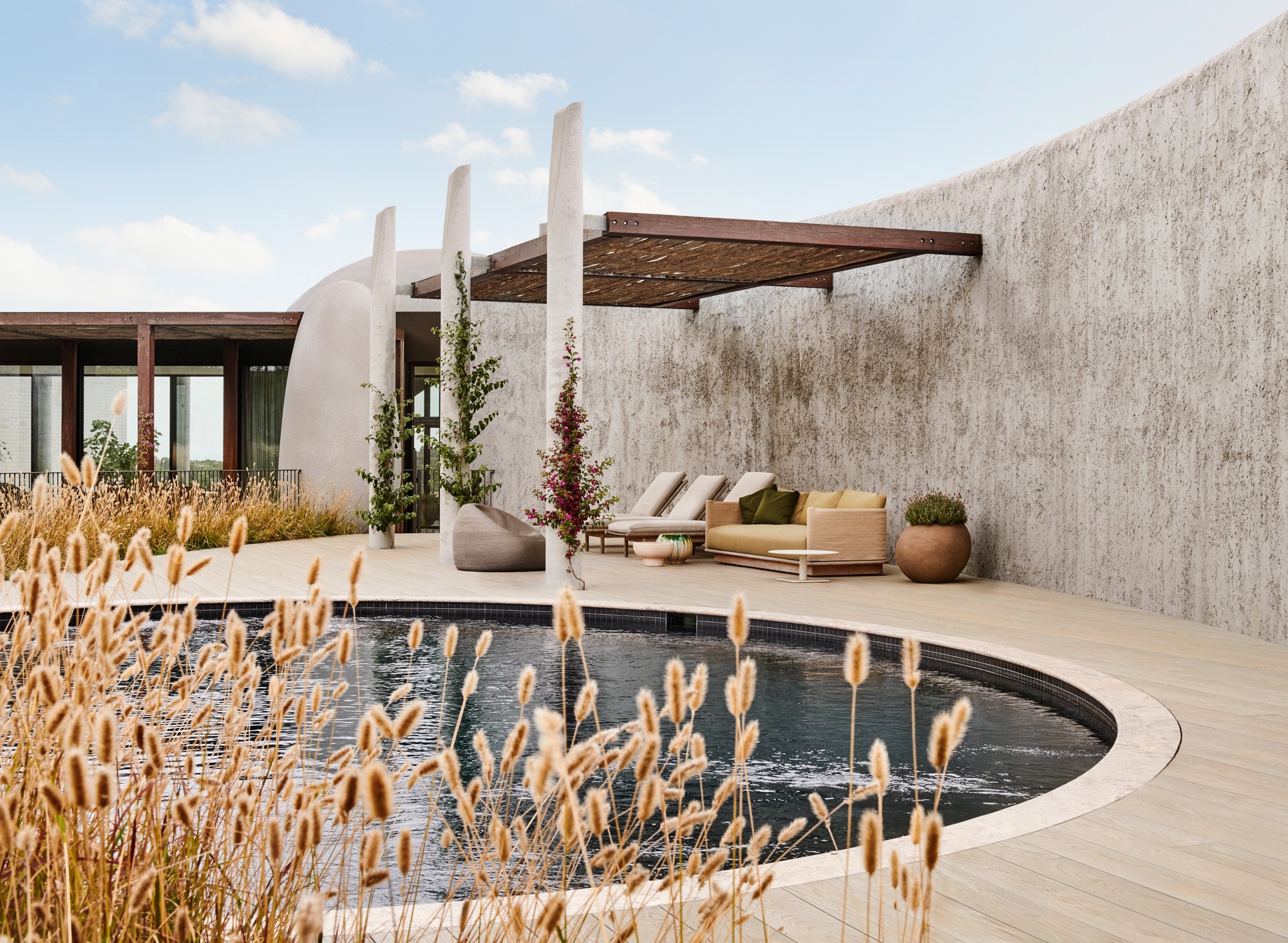 The Concrete Outcrop: Leeton Pointon's House on a Hill Emerges from the Landscape