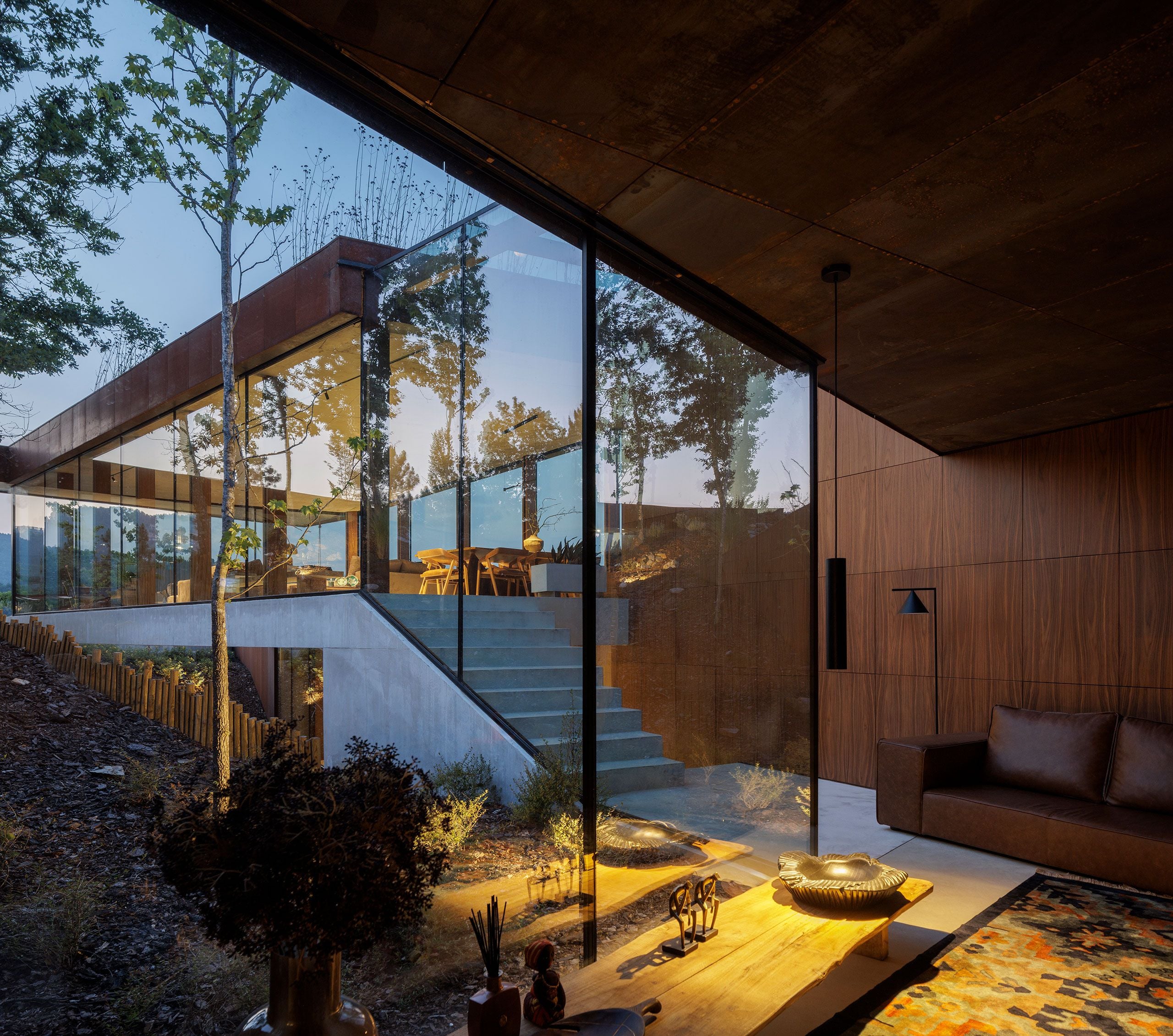 Casa Corten: A Weathered Steel Home That Grows From Portugal’s Hillside