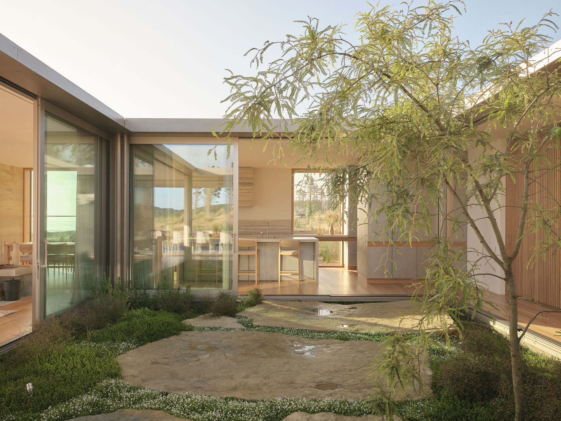 A House Between Horizons: Framing Light, Landscape, And Life Through Dual Courtyards