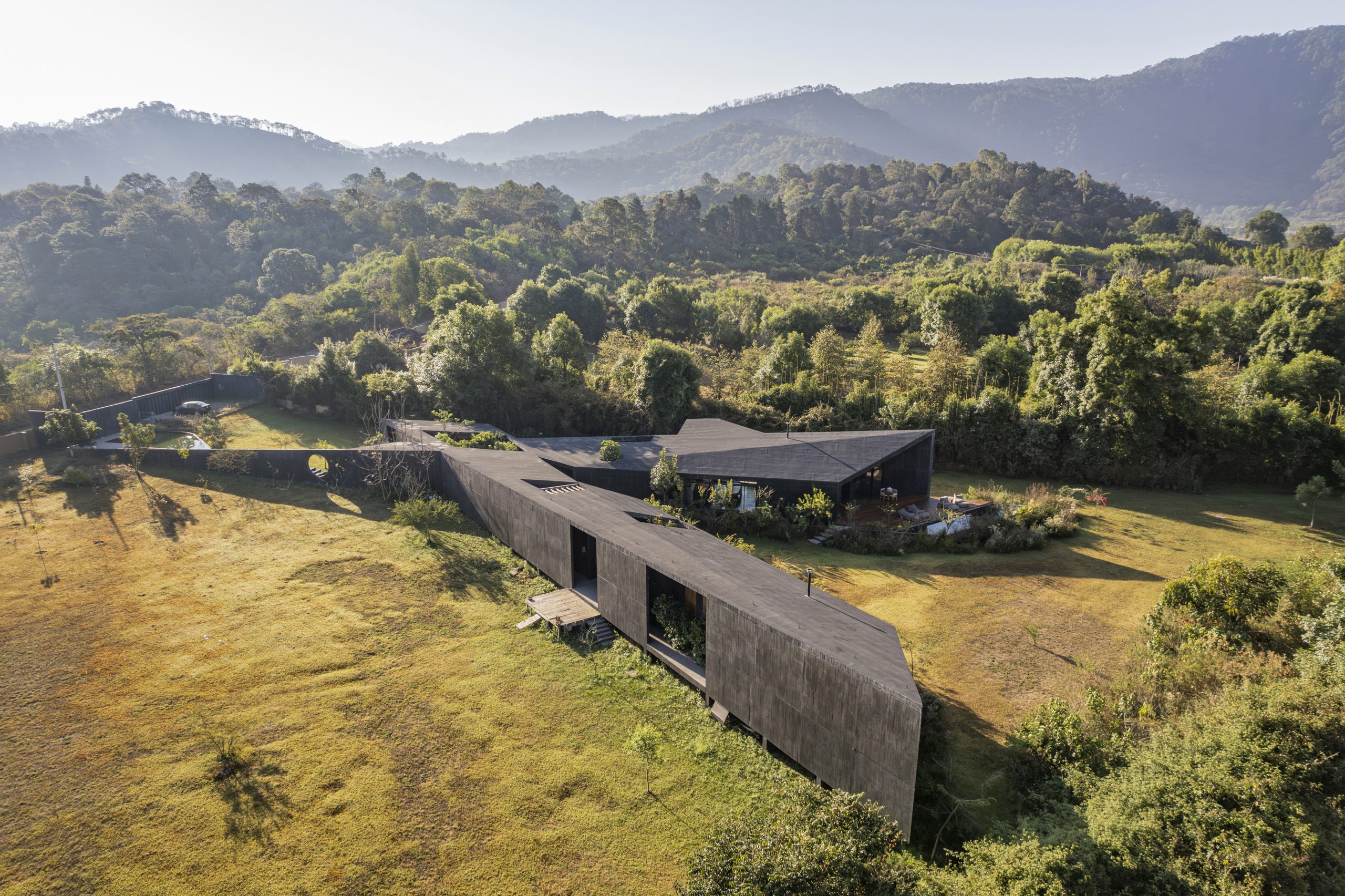 House Mavra: Where Black Concrete Frames The Landscape