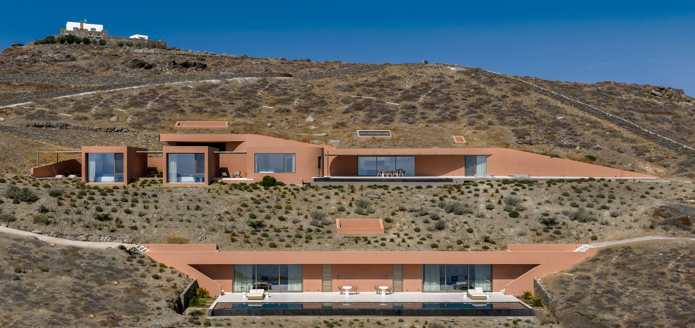 Where Stone Meets Sea: Ateno Architecture Studio Buries Olen Resort In Greece’s Rugged Coast