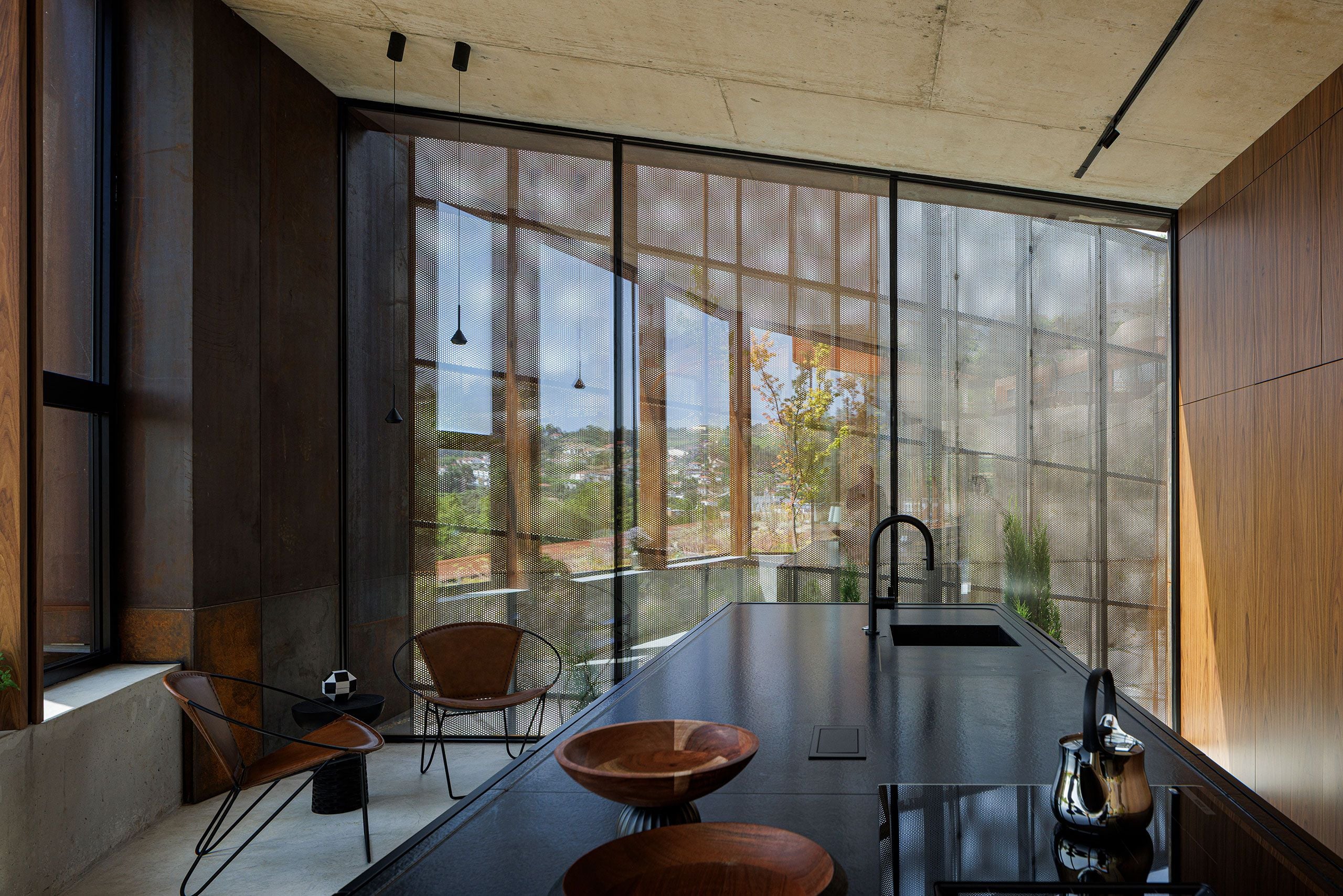 Casa Corten: A Weathered Steel Home That Grows From Portugal’s Hillside