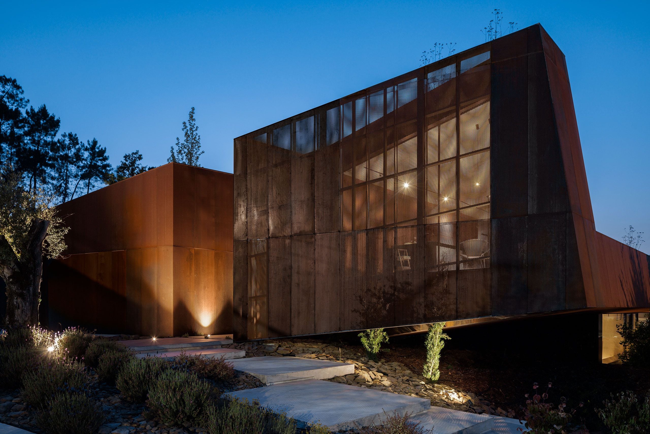 Casa Corten: A Weathered Steel Home That Grows From Portugal’s Hillside