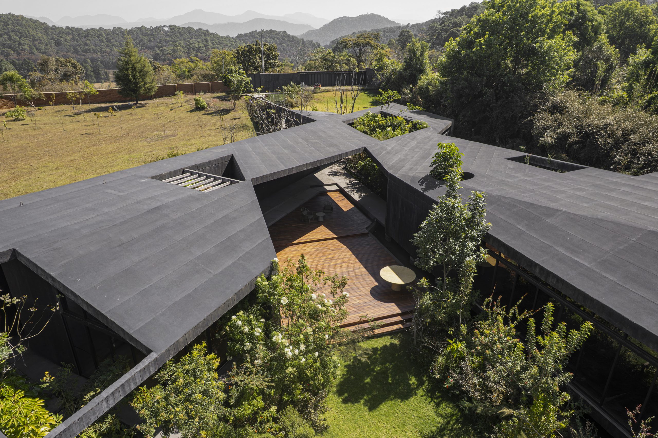 House Mavra: Where Black Concrete Frames The Landscape