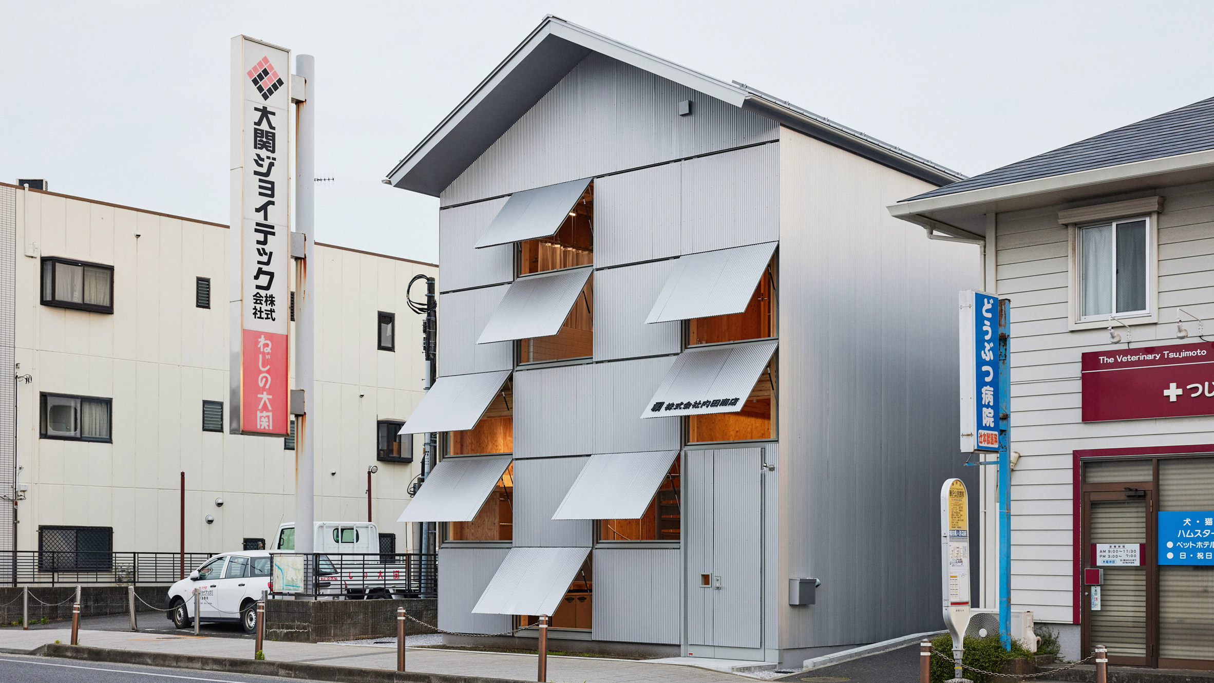 The Poetry of the Ordinary: Schemata Architects Wraps a Rice Dealer in Industrial Elegance