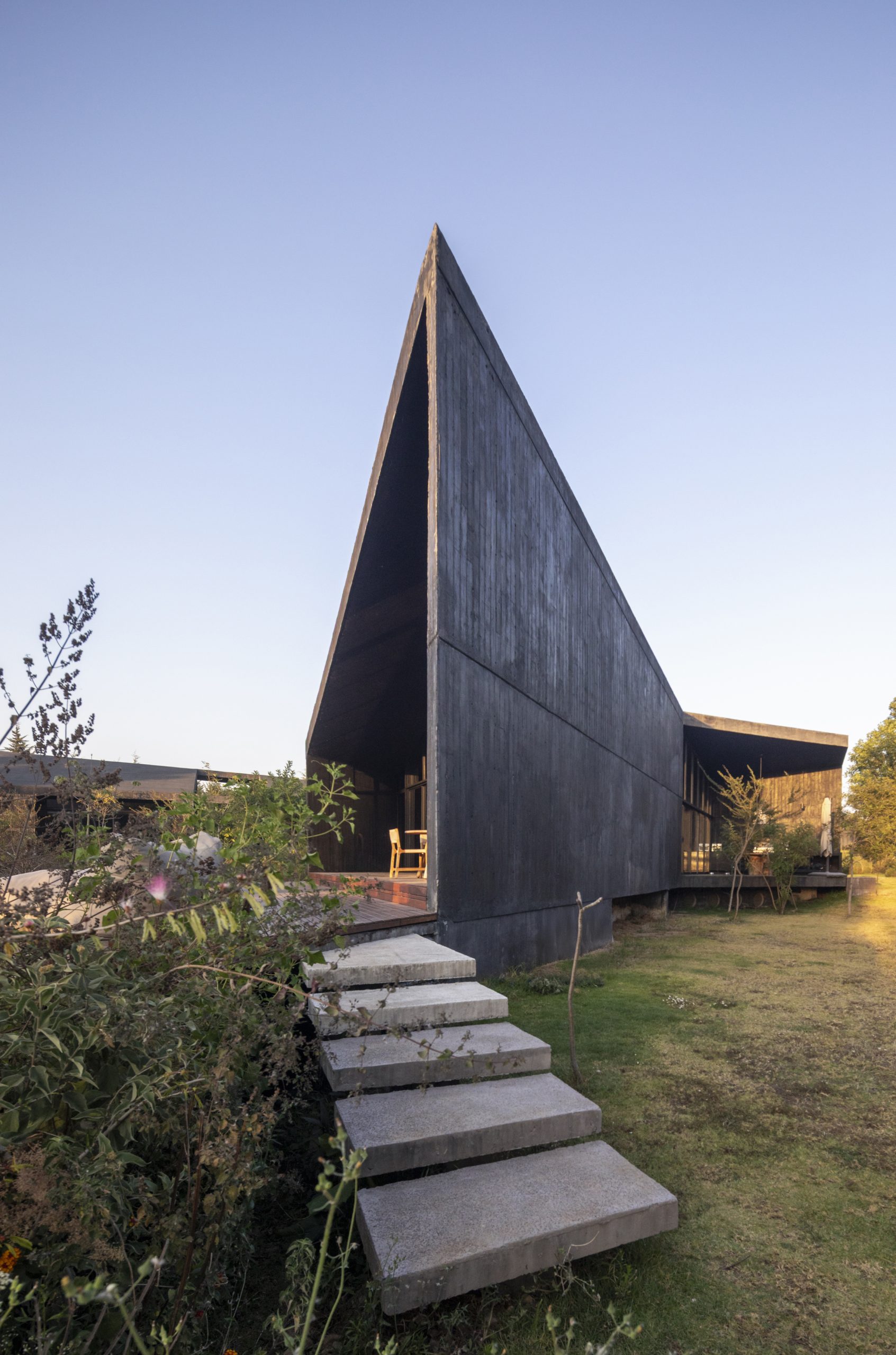 House Mavra: Where Black Concrete Frames The Landscape