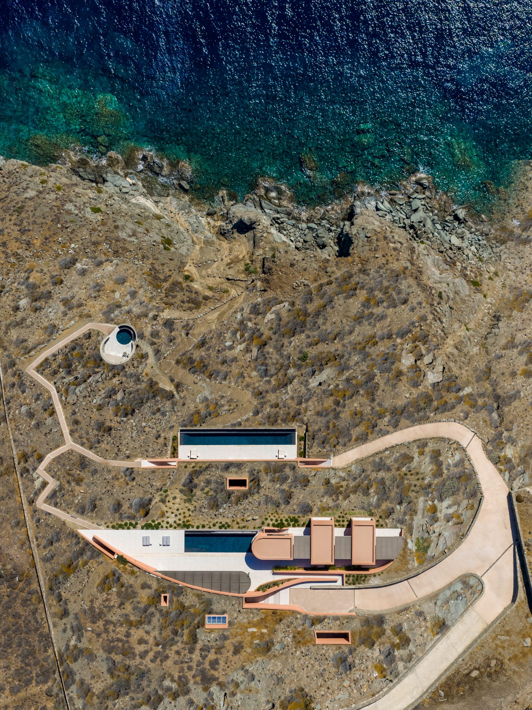 Where Stone Meets Sea: Ateno Architecture Studio Buries Olen Resort In Greece’s Rugged Coast