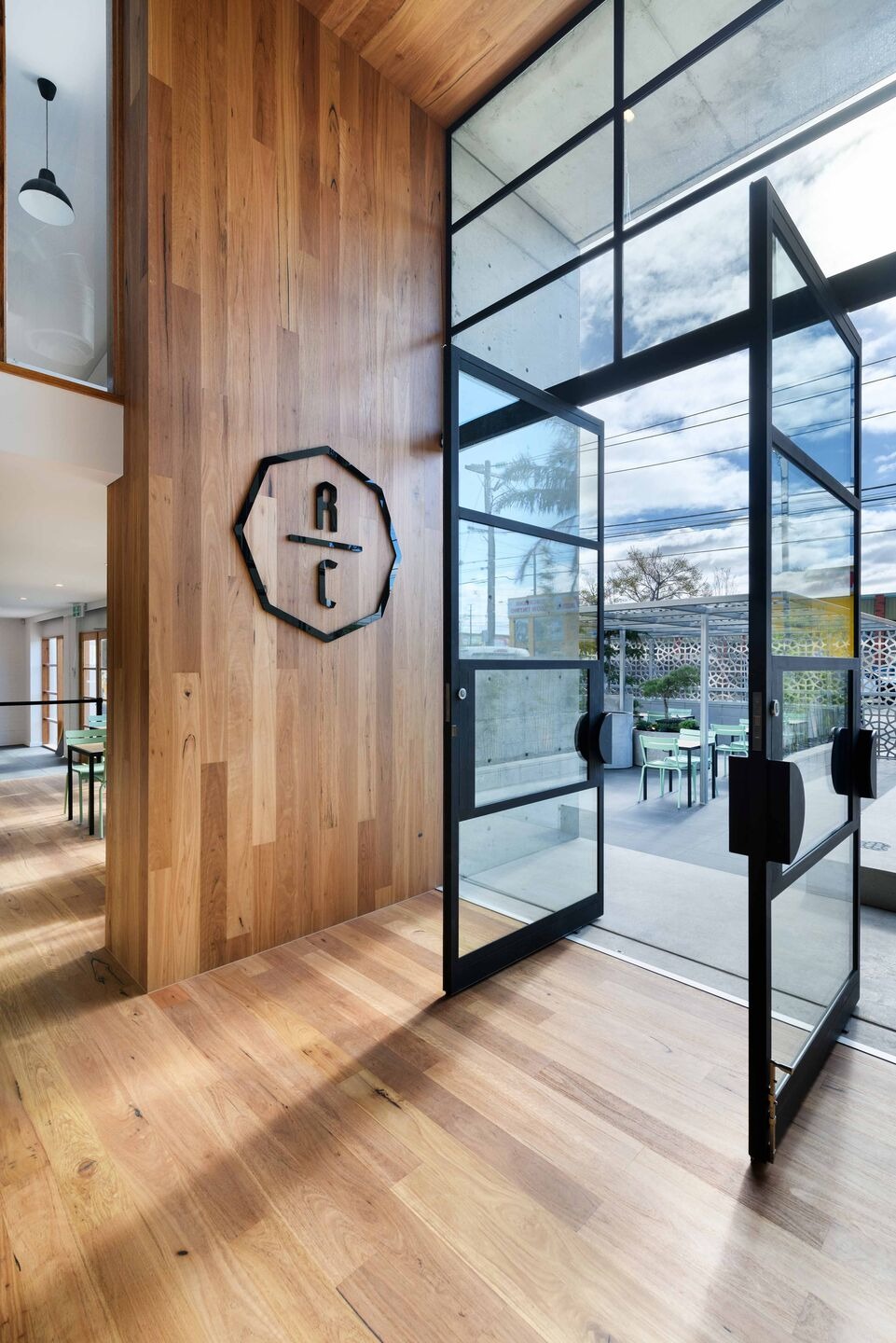 Rubia Café by pcg. Architects: Industrial Heritage Transformed into Warm Community Hub