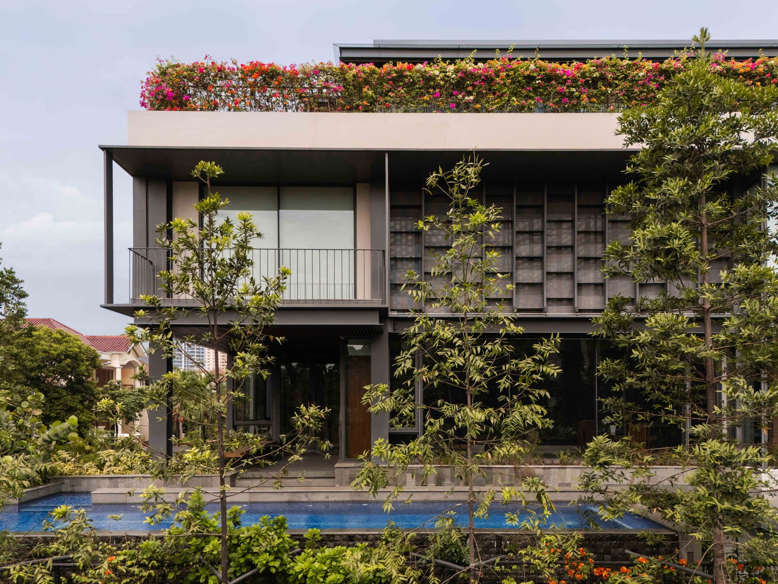 Steel Meets Softness in a Jakarta House That Borrows the Park Next Door