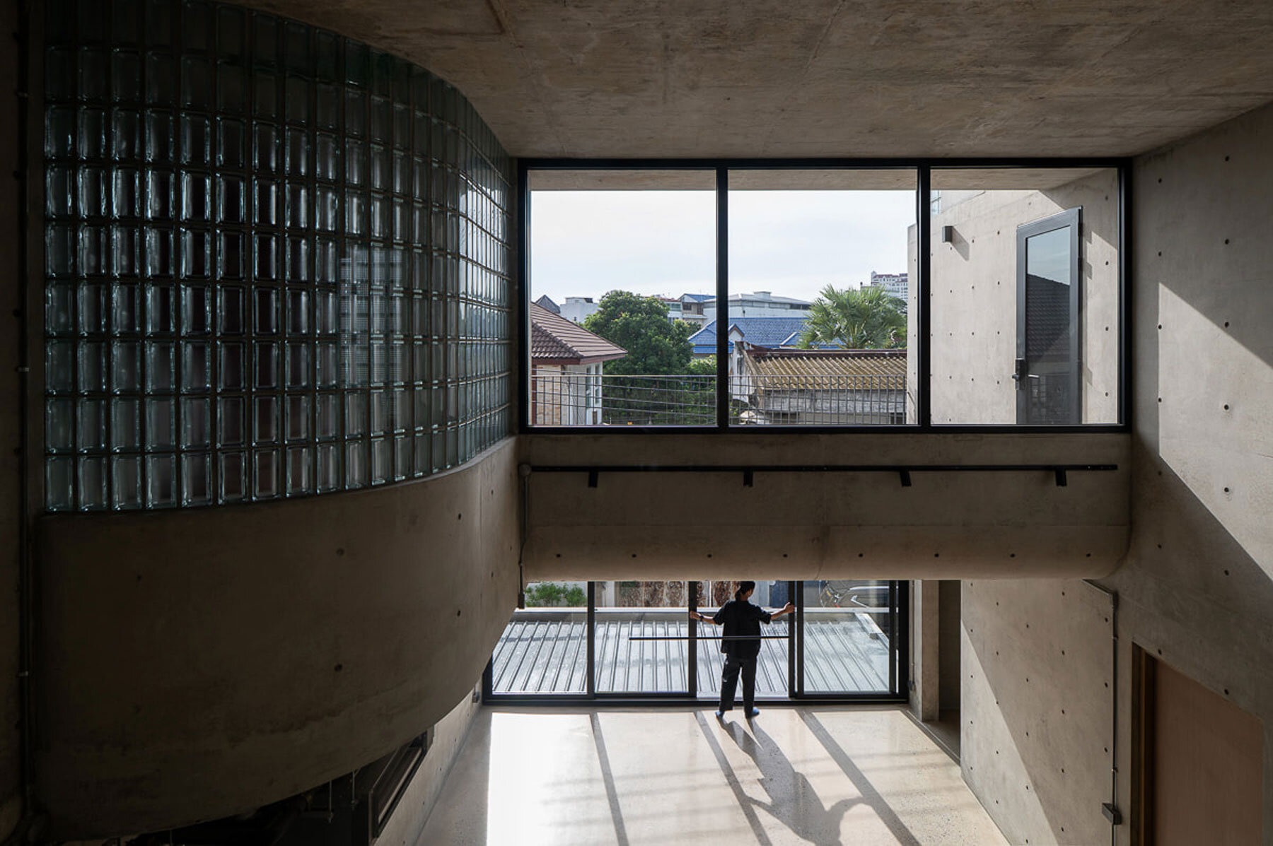 Studio Krubka Overcomes Bangkok Urban Density with Concrete Structure and Green Courtyard Core