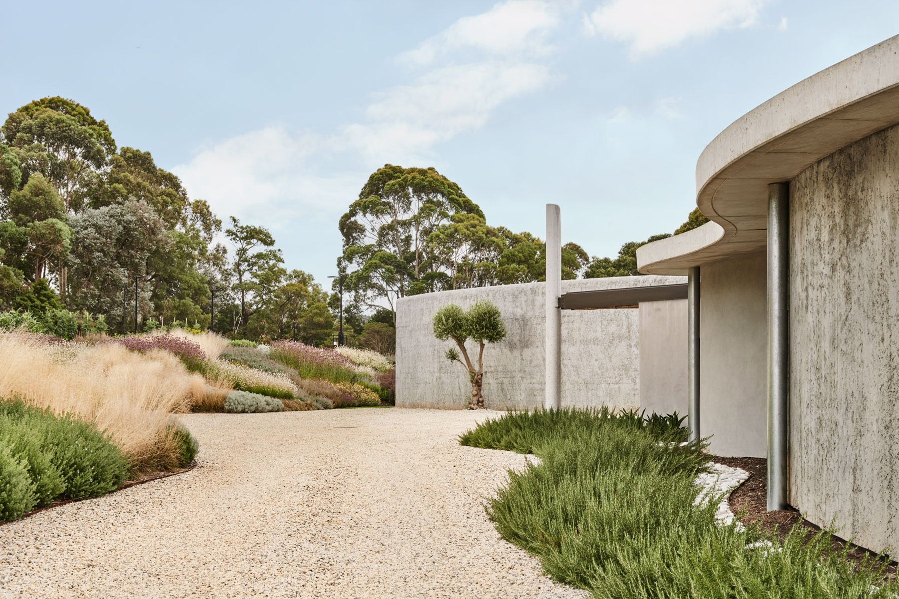 The Concrete Outcrop: Leeton Pointon's House on a Hill Emerges from the Landscape