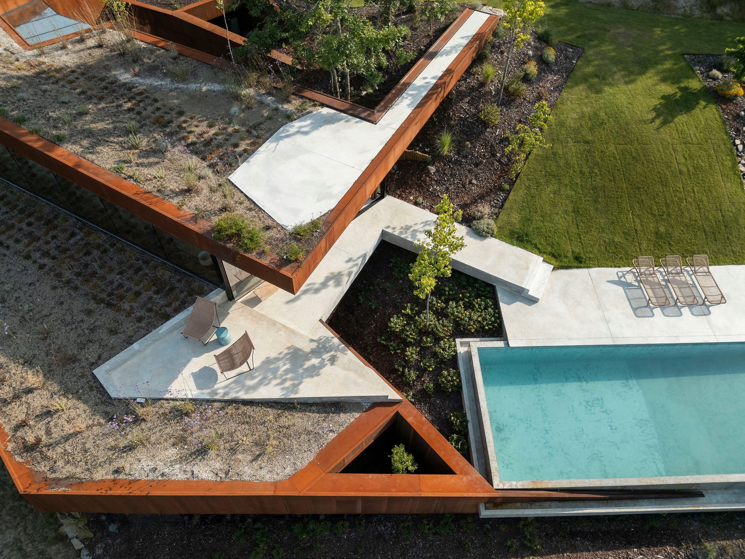 Casa Corten: A Weathered Steel Home That Grows From Portugal’s Hillside