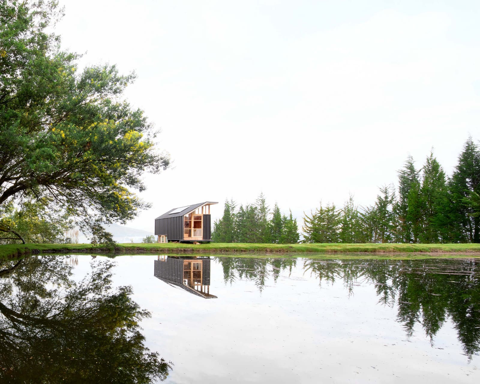 Building on Working Land: A Compact Retreat Among Ecuador's Pastoral Foothills