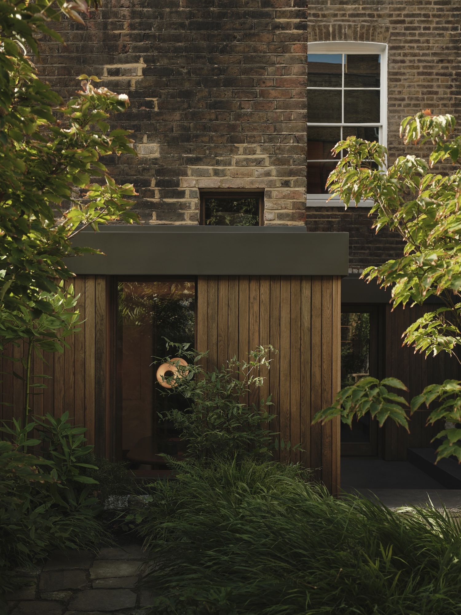 Tectonics Of Stillness: Material Restraint And Spatial Inversion In Heion House