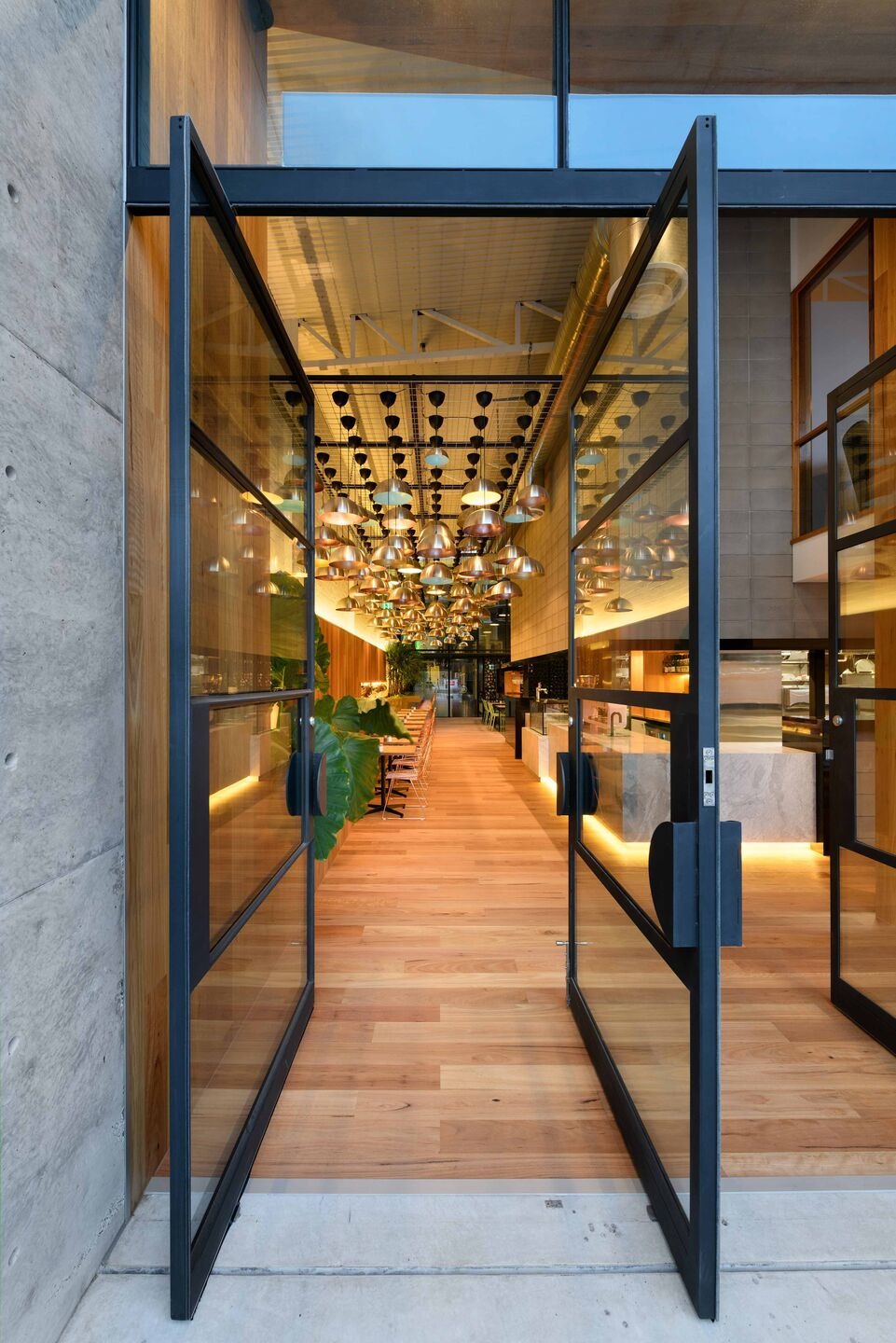 Rubia Café by pcg. Architects: Industrial Heritage Transformed into Warm Community Hub
