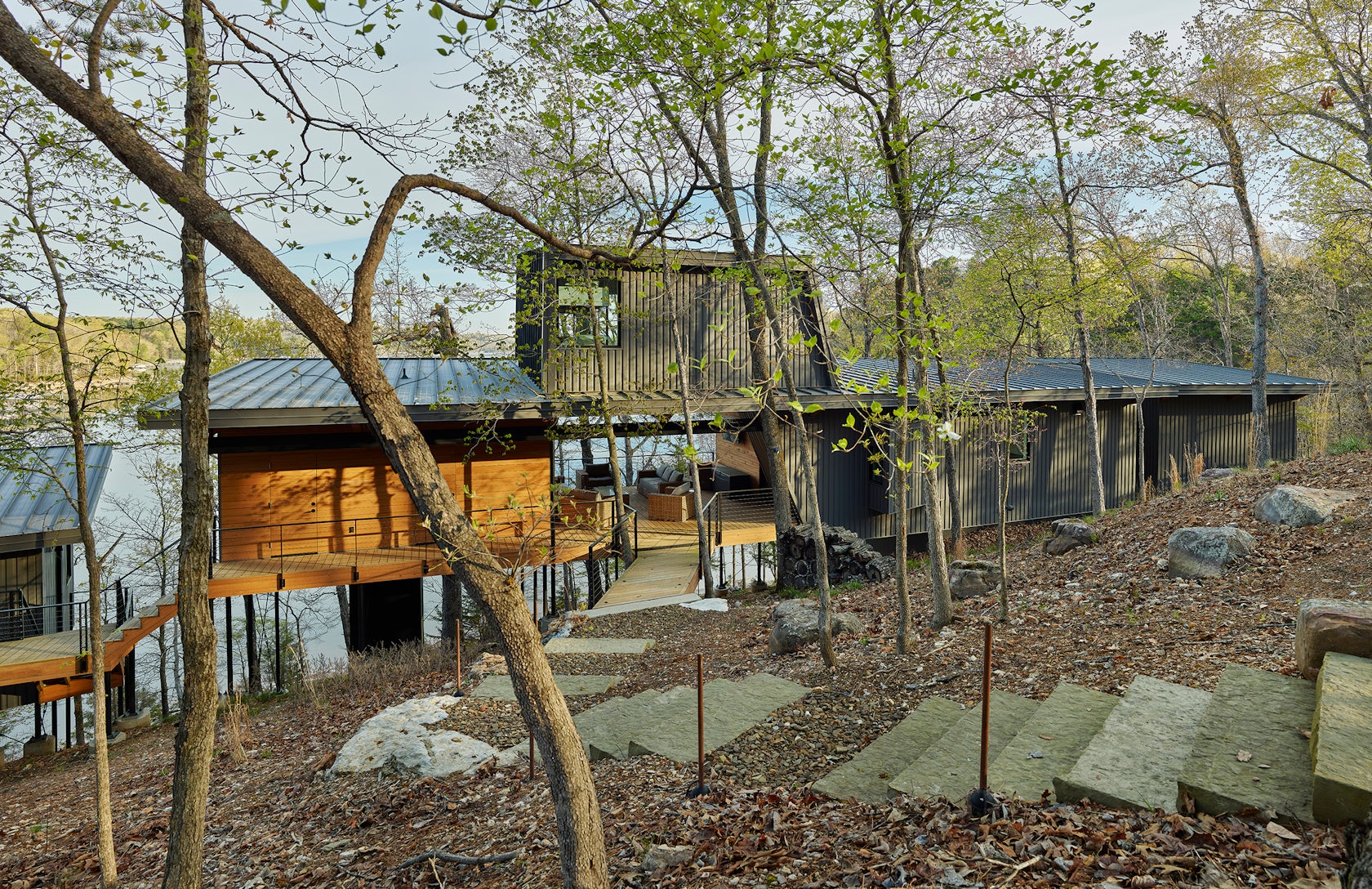 Modus Studio’s Grist Mill Cabin Blends Deconstructed Lakehouse Design With The Natural Hillside Of Beaver Lake