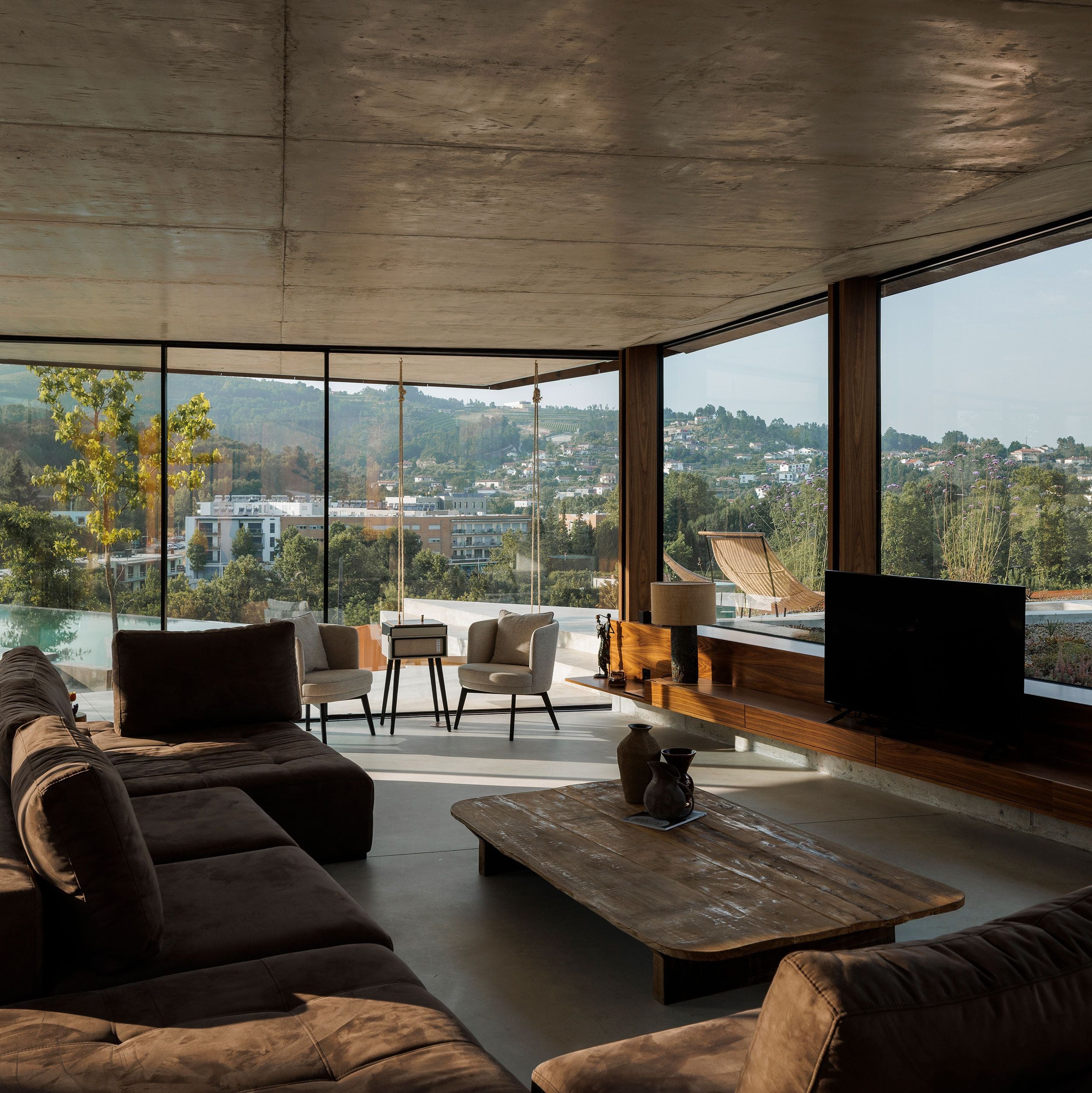 Casa Corten: A Weathered Steel Home That Grows From Portugal’s Hillside