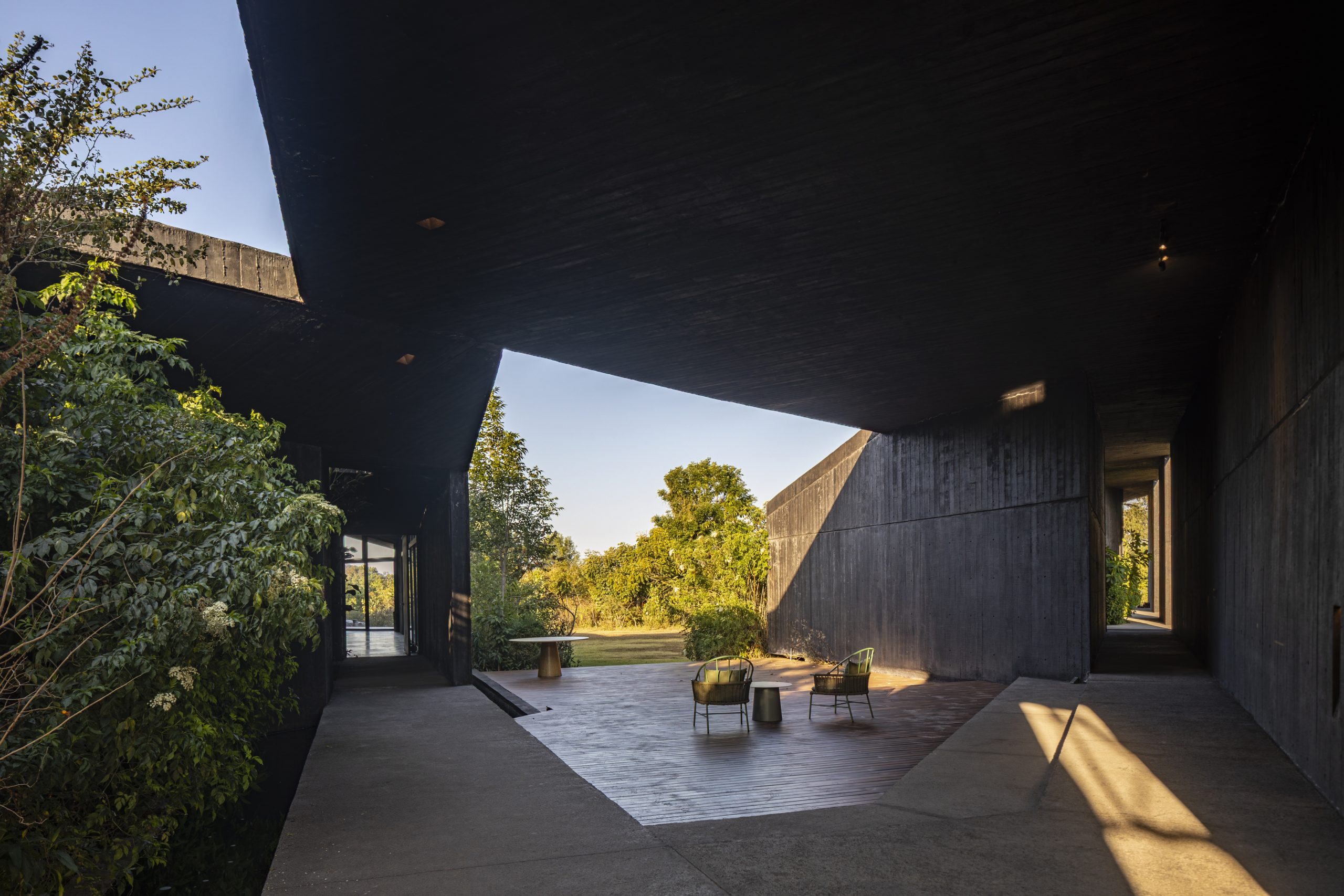 House Mavra: Where Black Concrete Frames The Landscape