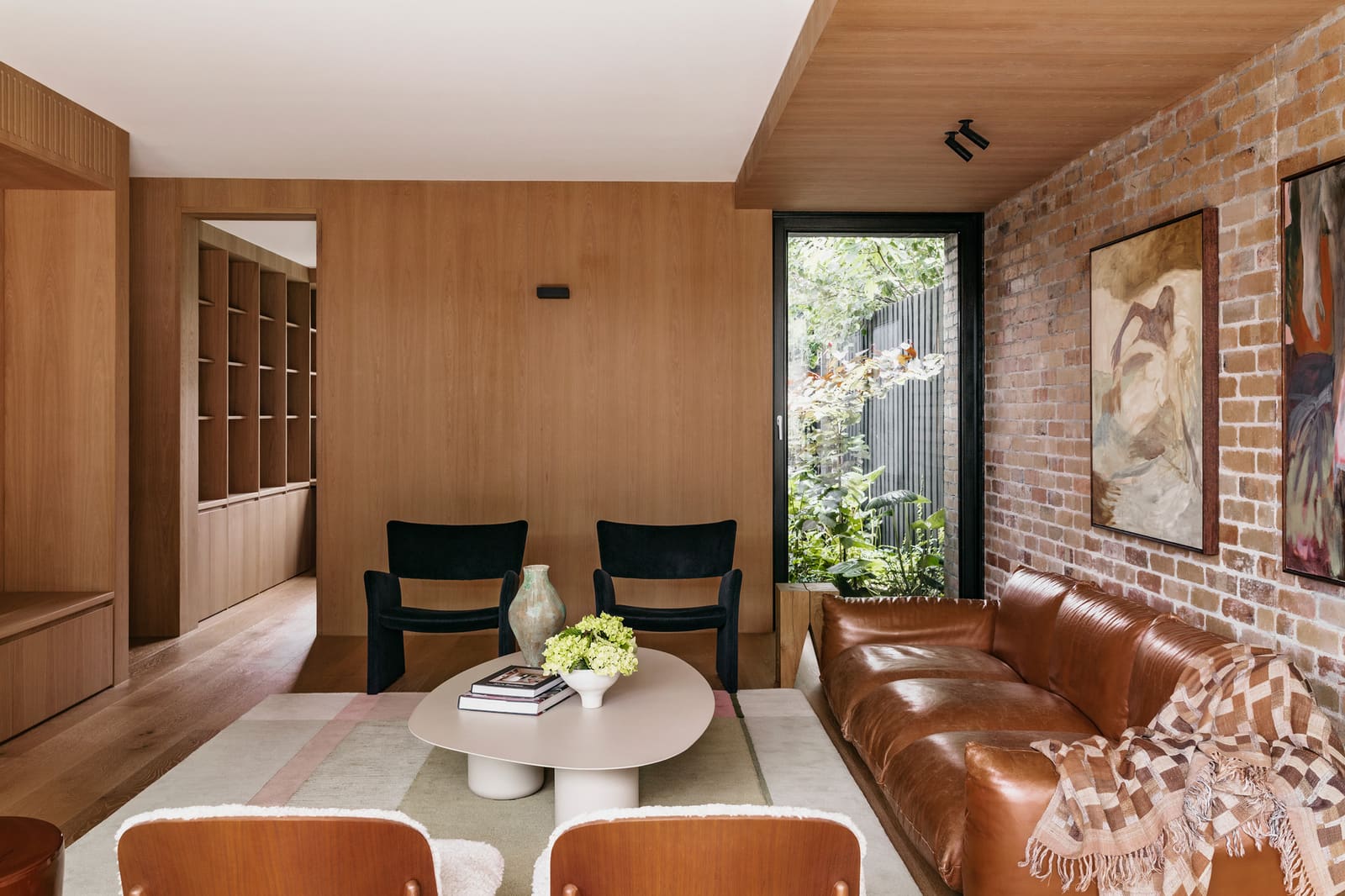When a House Holds Two Moods: Restraint Outside, Warmth Within