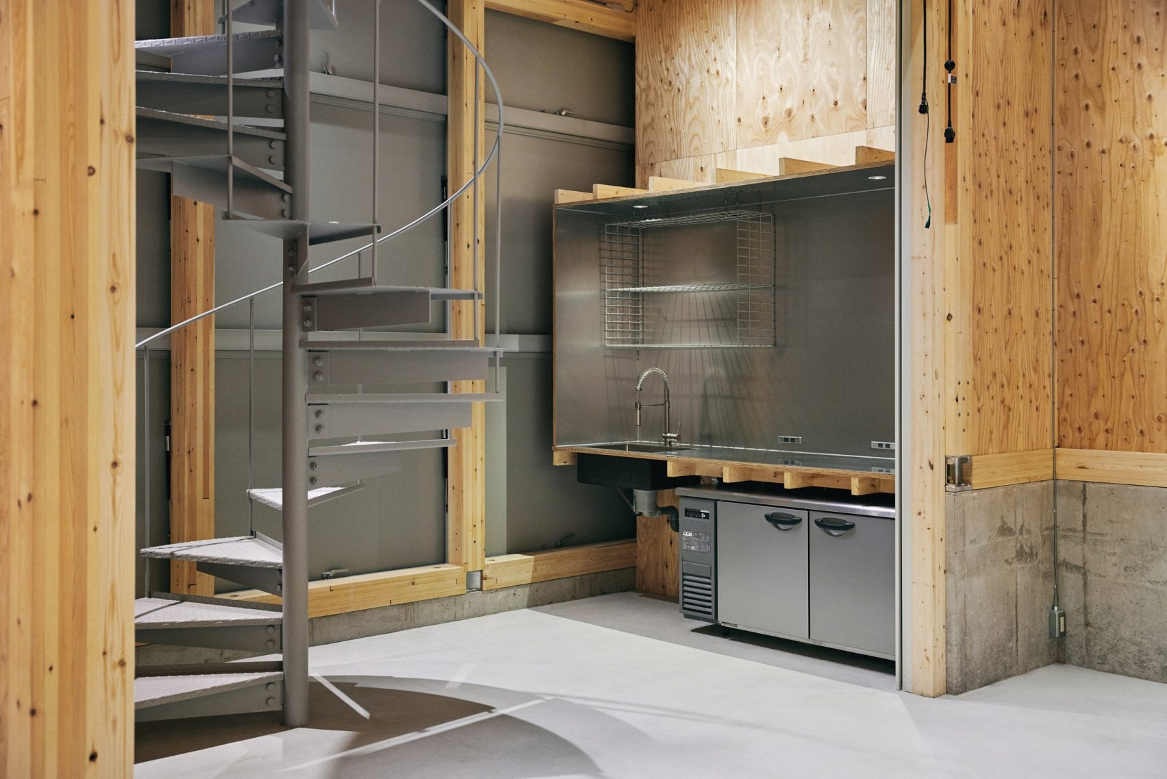 The Poetry of the Ordinary: Schemata Architects Wraps a Rice Dealer in Industrial Elegance