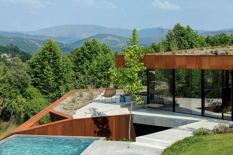 Casa Corten: A Weathered Steel Home That Grows From Portugal’s Hillside