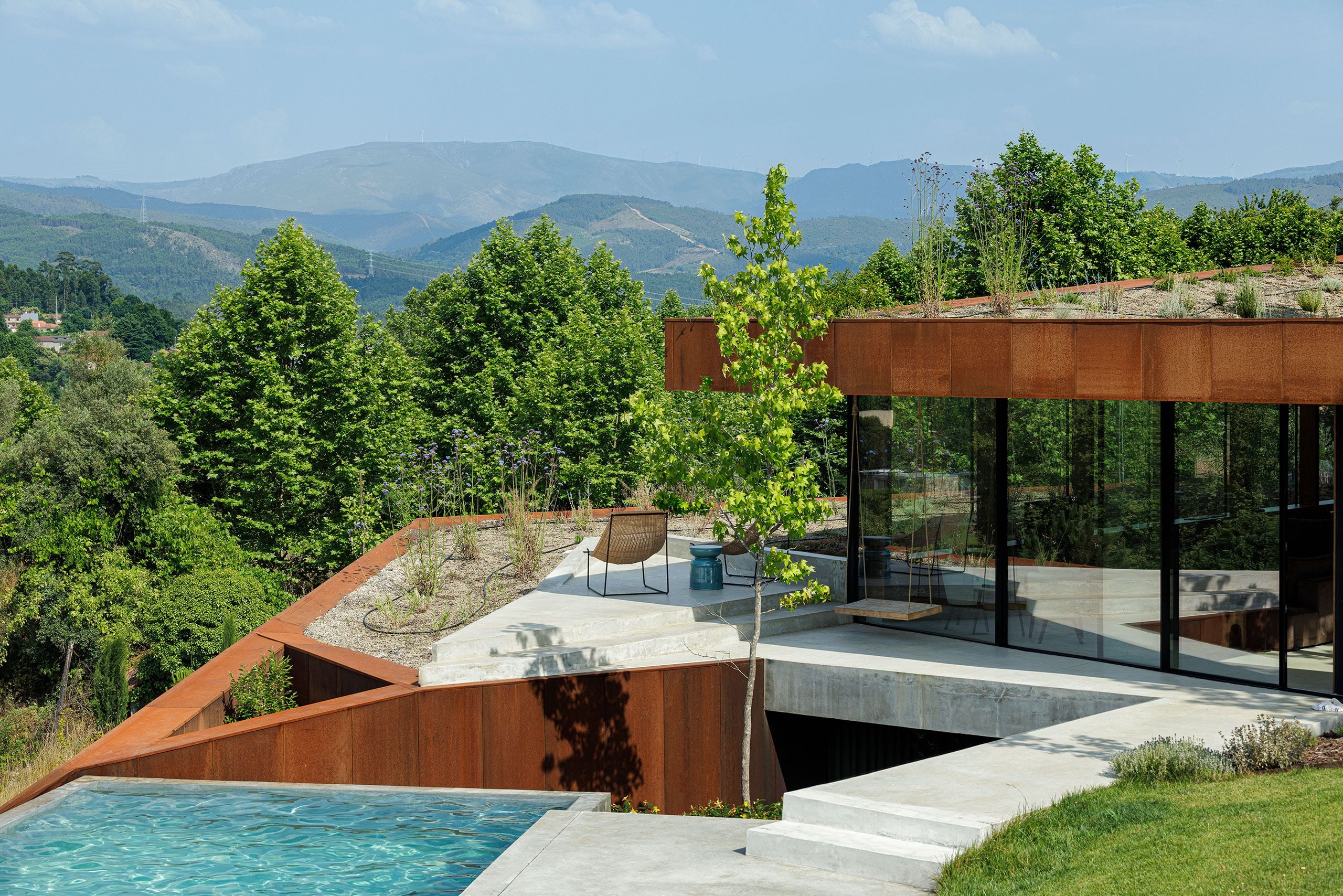 Casa Corten: A Weathered Steel Home That Grows From Portugal’s Hillside