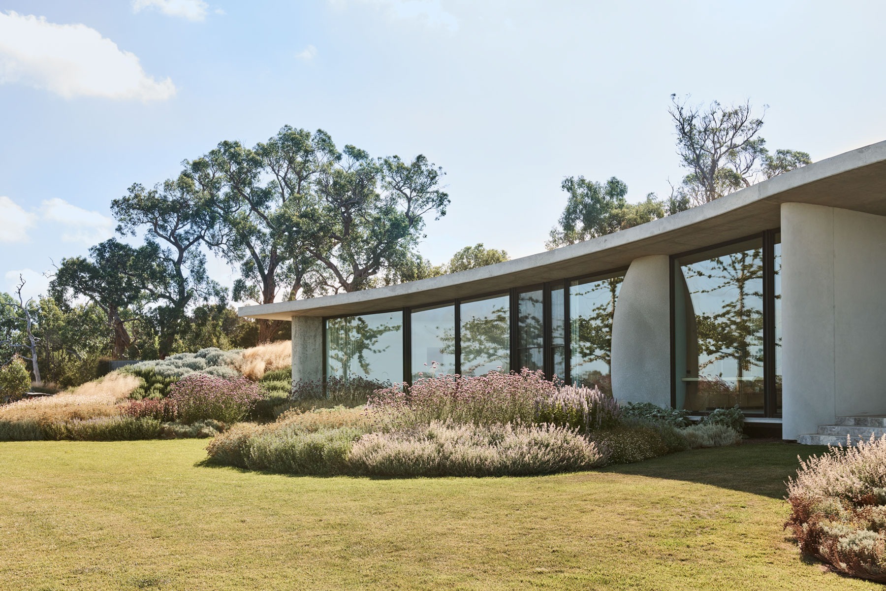 The Concrete Outcrop: Leeton Pointon's House on a Hill Emerges from the Landscape