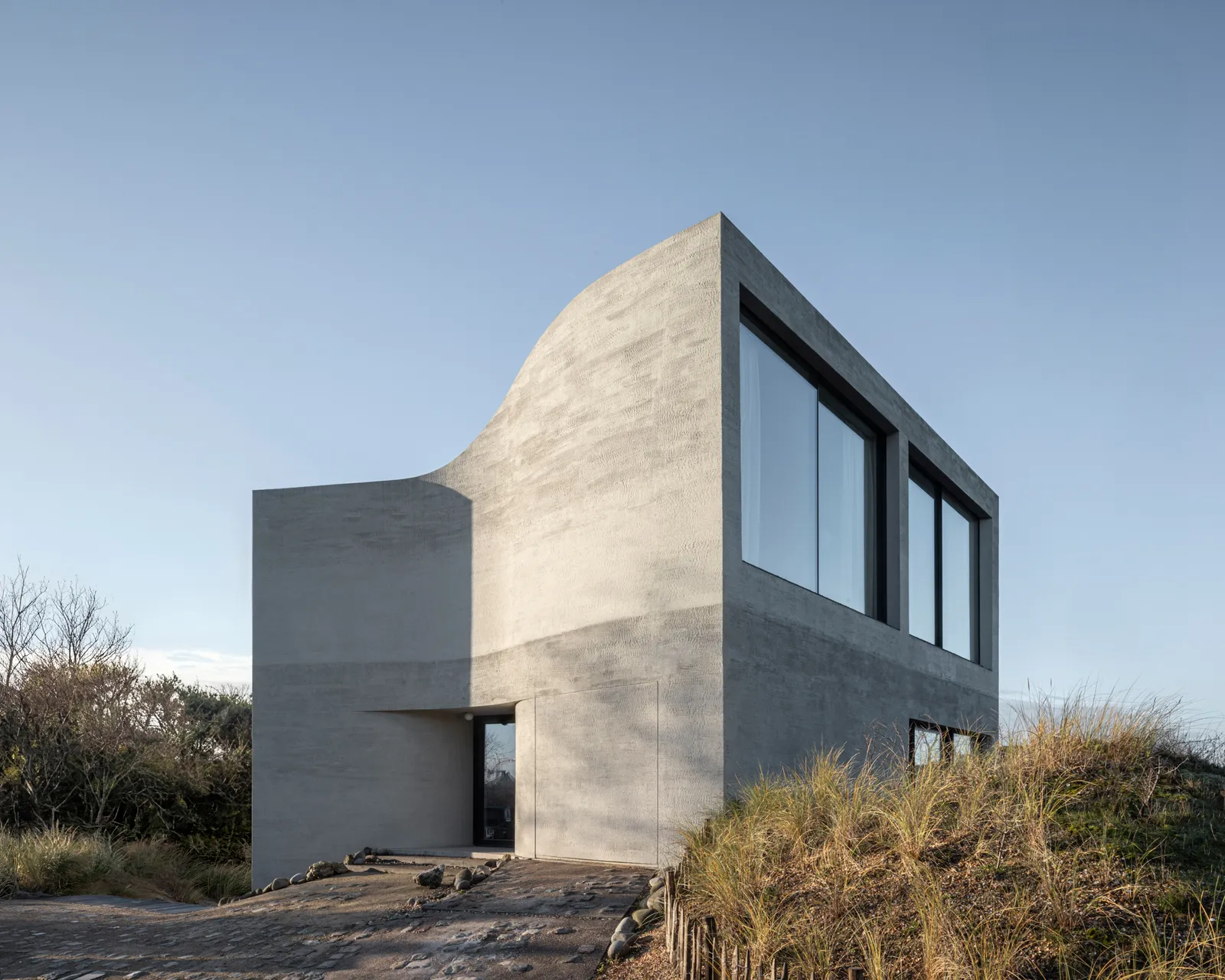 Shaped By Tide And Time: Inside Belgium’s Sculptural Concrete Seaside Villa
