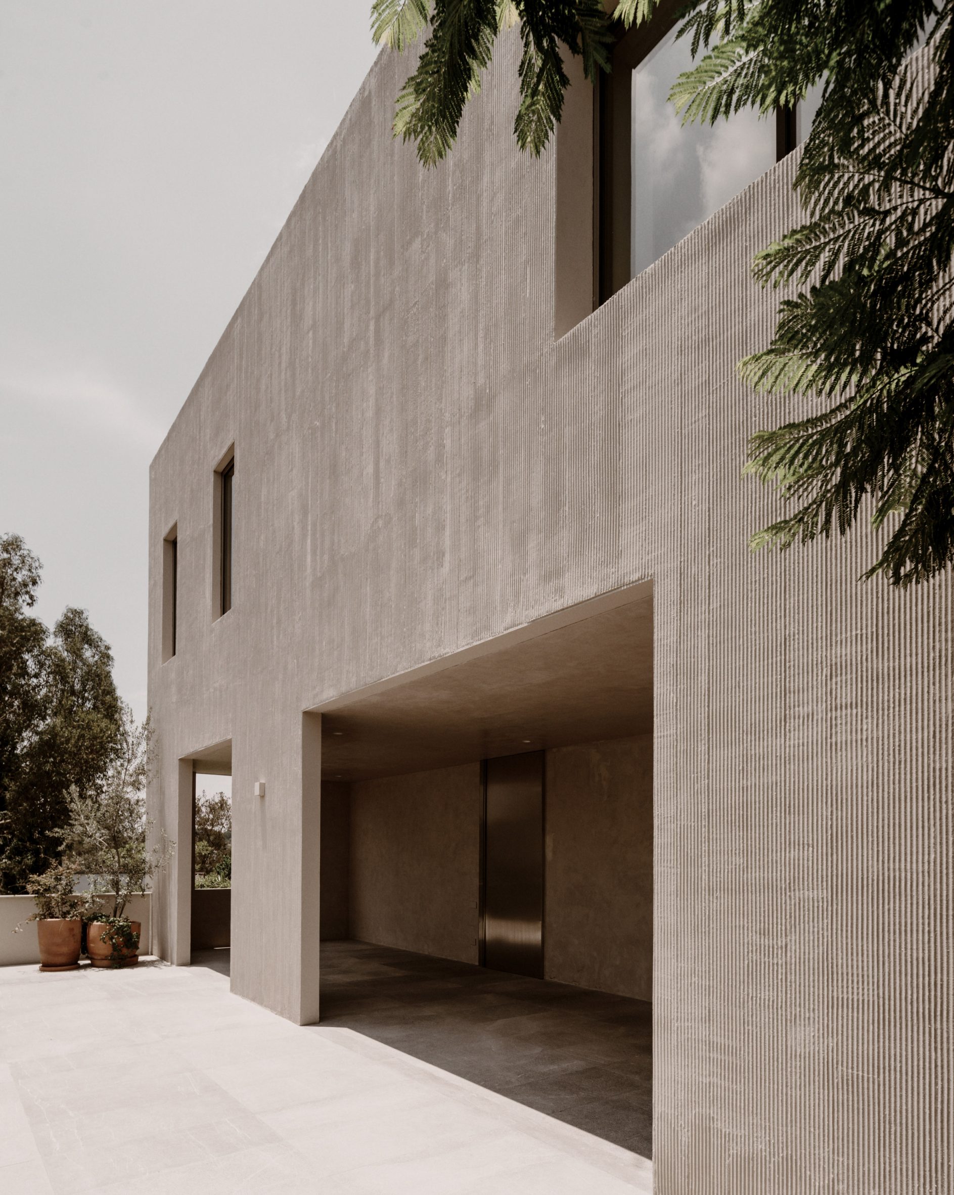 Suspended Gravity: A Concrete House That Refuses To Touch The Ground