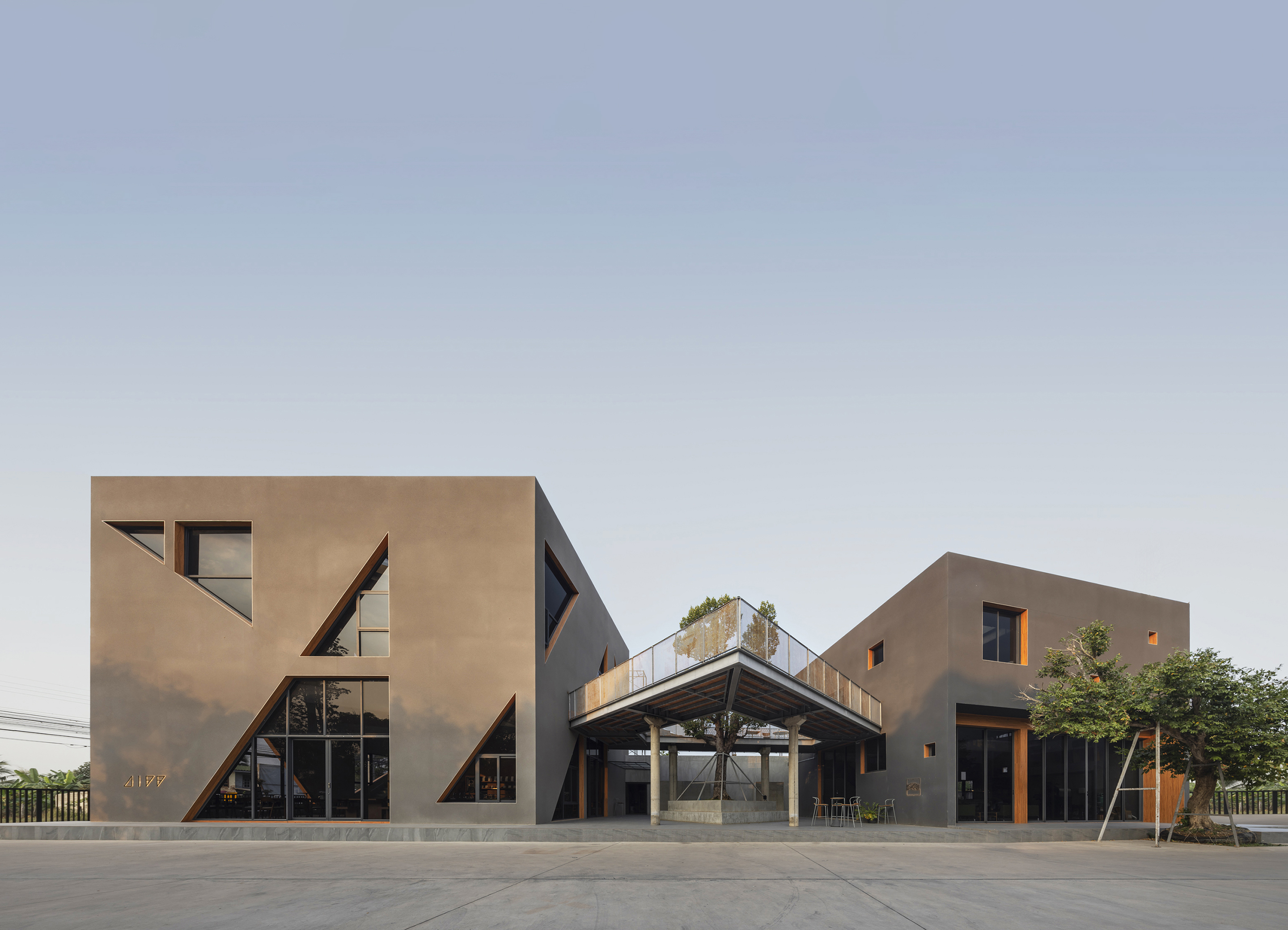 DIFF Coffee Roasters by ASWA: Minimalist Concrete Cubes Bridged by Nature in Phitsanulok